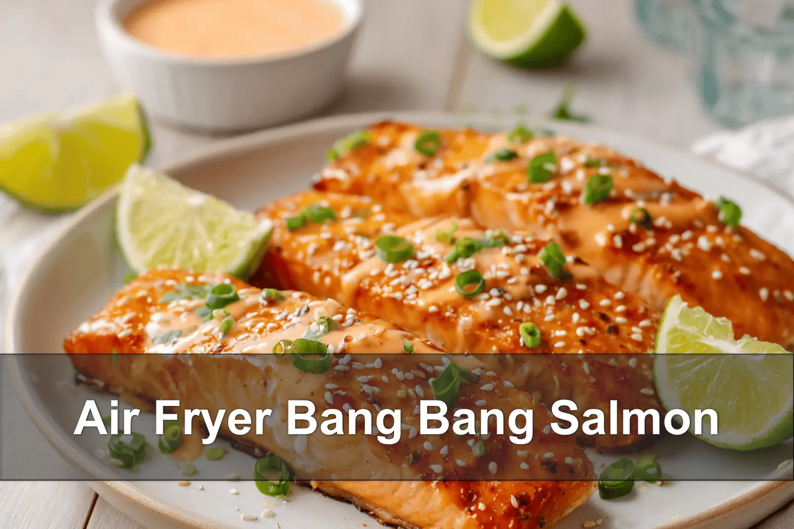 Air Fryer Bang Bang Salmon glazed with creamy chili mayo sesame seeds and green onions
