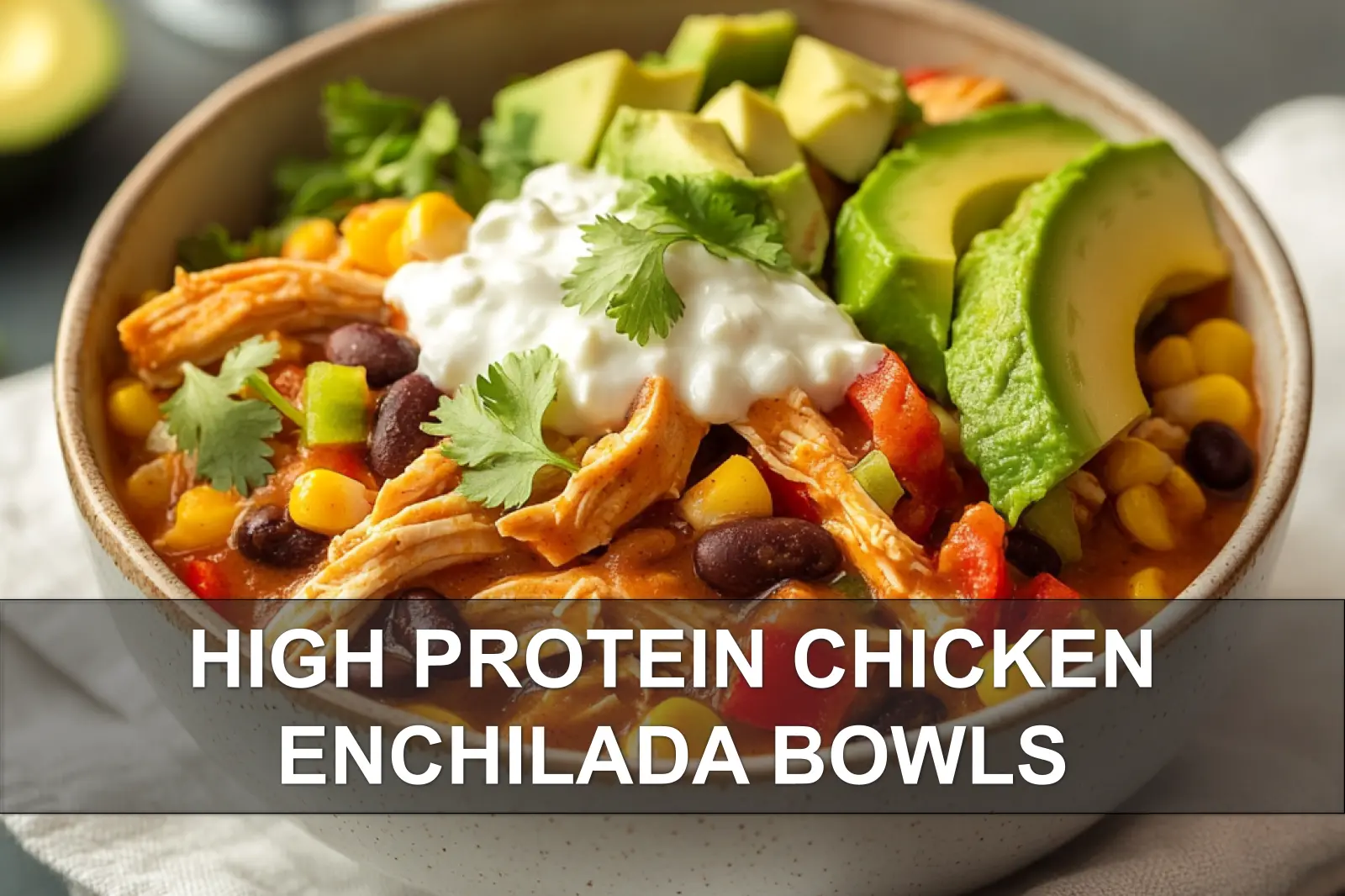 HIGH PROTEIN CHICKEN ENCHILADA BOWLS bowl with avocado slices and fresh herbs warm light