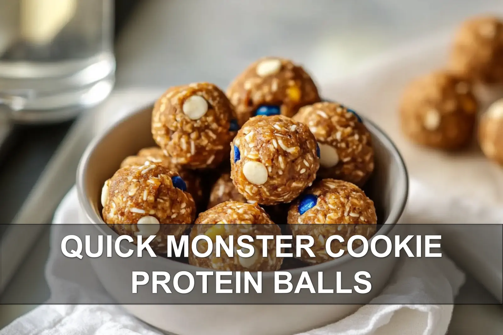 Quick Monster Cookie Protein Balls: Easy and Irresistible 4 QUICK MONSTER COOKIE PROTEIN BALLS close-up on white napkin with glass of water warm focus