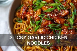 Sticky Garlic Chicken Noodles: Irresistible Recipe to Try STICKY GARLIC CHICKEN NOODLES glossy egg noodles with caramelized chicken and sesame seeds