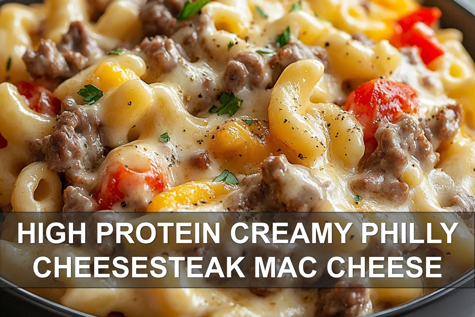 18 High Protein Recipes: Easy & Delicious Meal Ideas 13 A skillet of creamy Philly cheesesteak mac and cheese with peppers and onions.